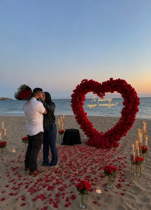 Beach proposal setup with candles by Big Moments Co.